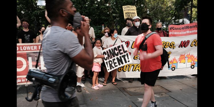 NEW YORK, NEW YORK - AUGUST 11: Activists hold a protest against evictions near City Hall on August 11, 2021 in New York City. New York state’s current eviction moratorium is set to expire on August 31. The Emergency Rental Assistance Program, which was created in the state budget and is meant to cover a year’s worth of rent and utility bills for tenants at or below 80% of area median income, has struggled to address the thousands of caseloads of tenants facing eviction. (Photo by Spencer Platt/Getty Images)
